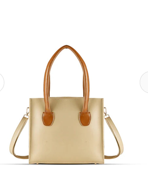 Beige handbag with brown handles and tassels
