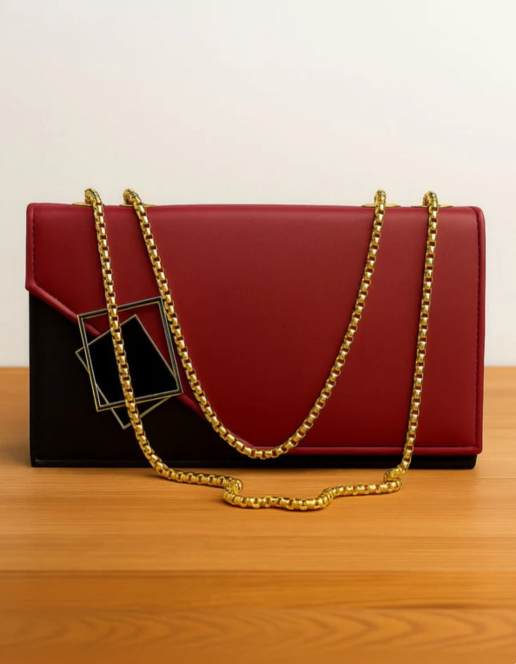 Red handbag with a gold chain 