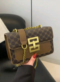 Brown patterned handbag with gold chain and clasp 