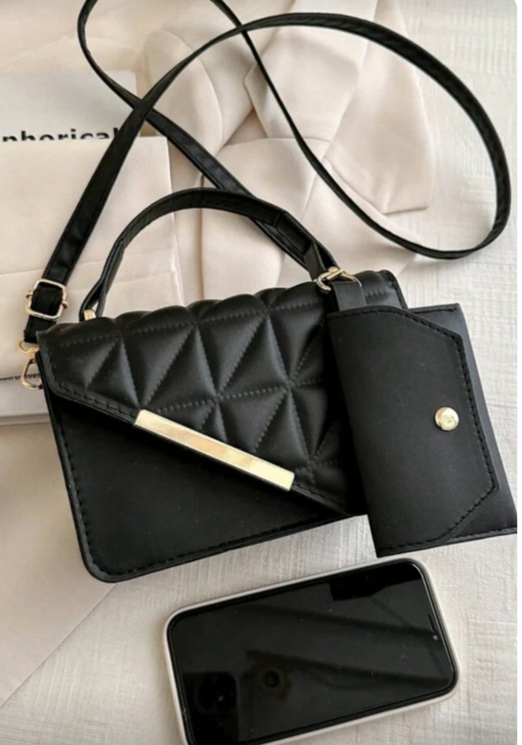 Black quilted handbag with a matching wallet 