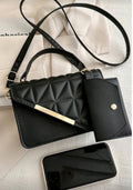 Black quilted handbag with a matching wallet 