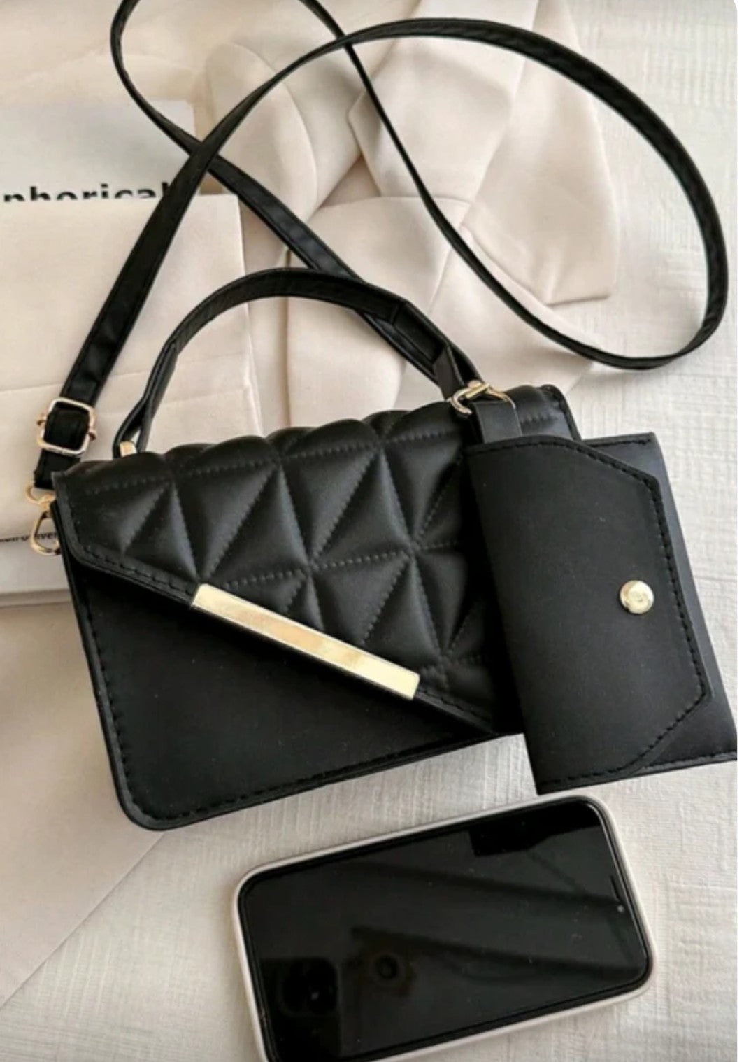 Black quilted handbag with a matching wallet 