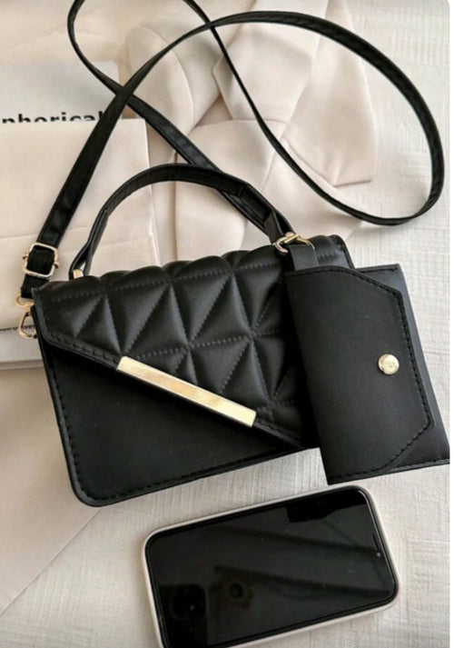 Black quilted handbag with a matching wallet 