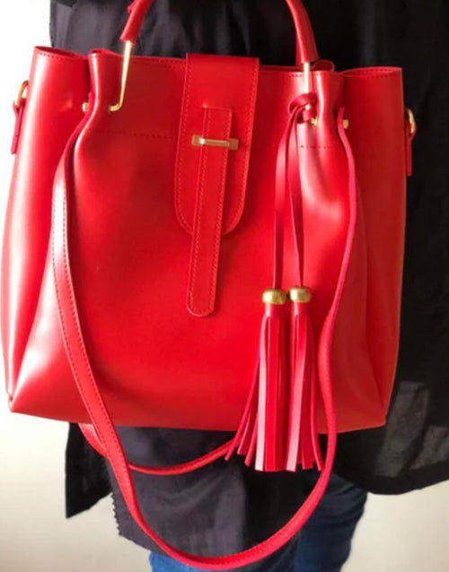 Red handbag with gold accents 
