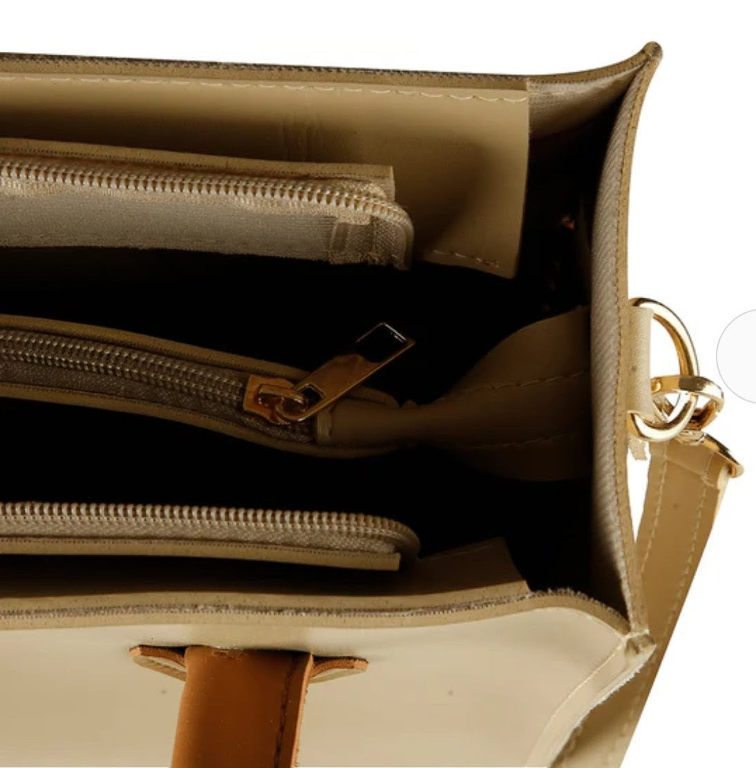 Beige handbag with brown handles and tassels